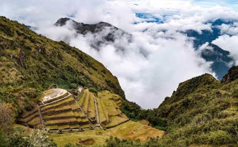 View of Incan ruins in Peru shrouded in mist