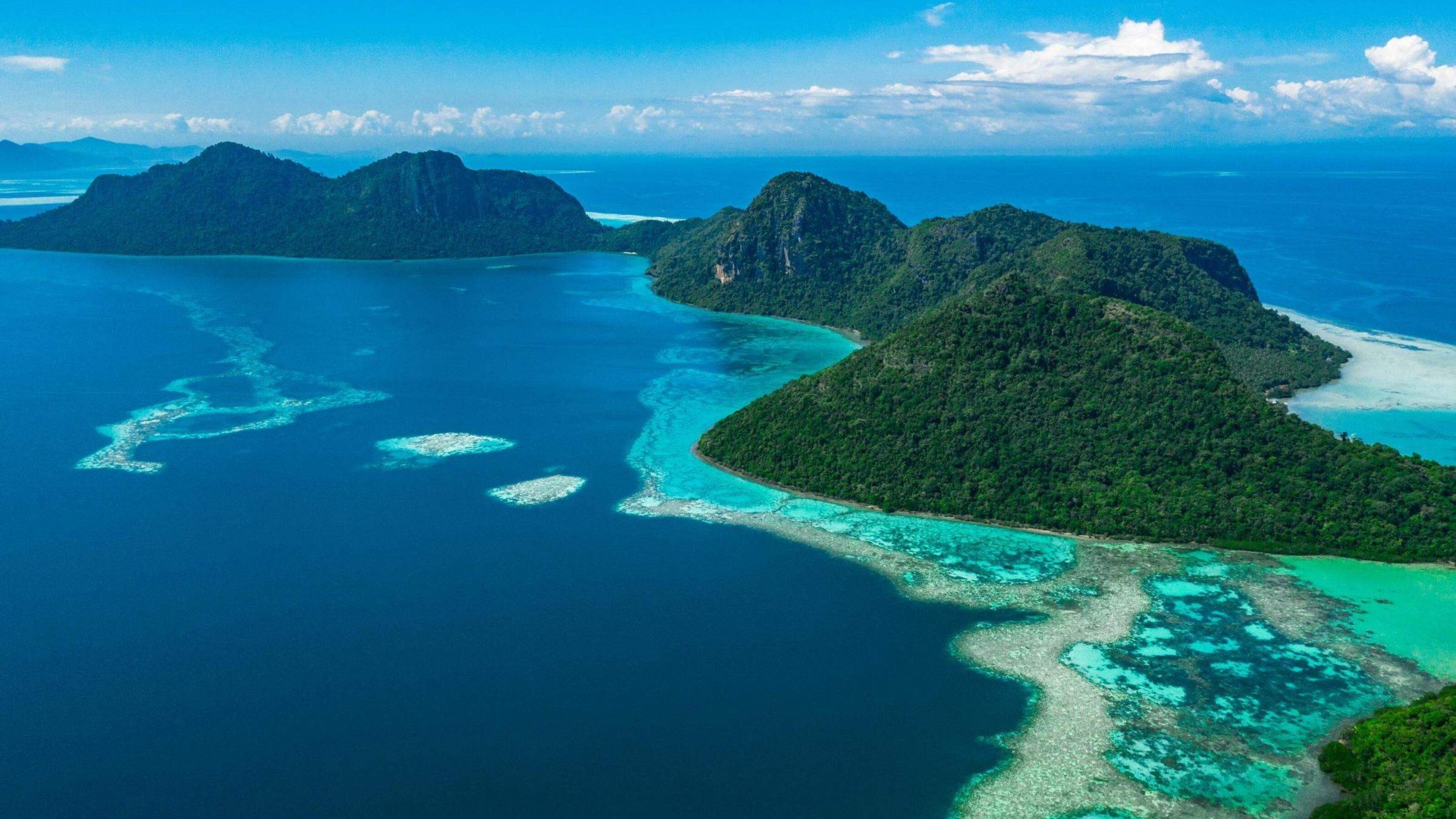 An aerial view of lush tropical islands in Borneo.