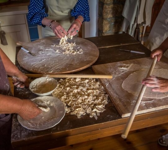 Women participating in a traditional Greek cooking class