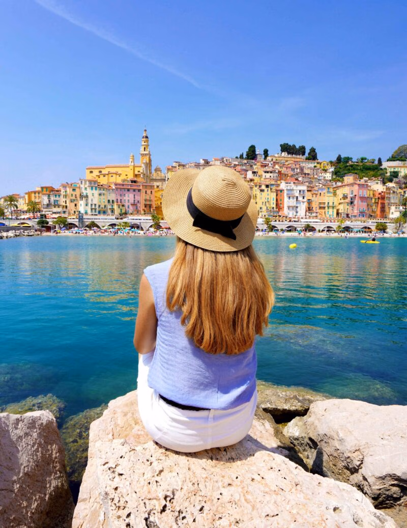 A woman enjoys the view on the French Riviera.