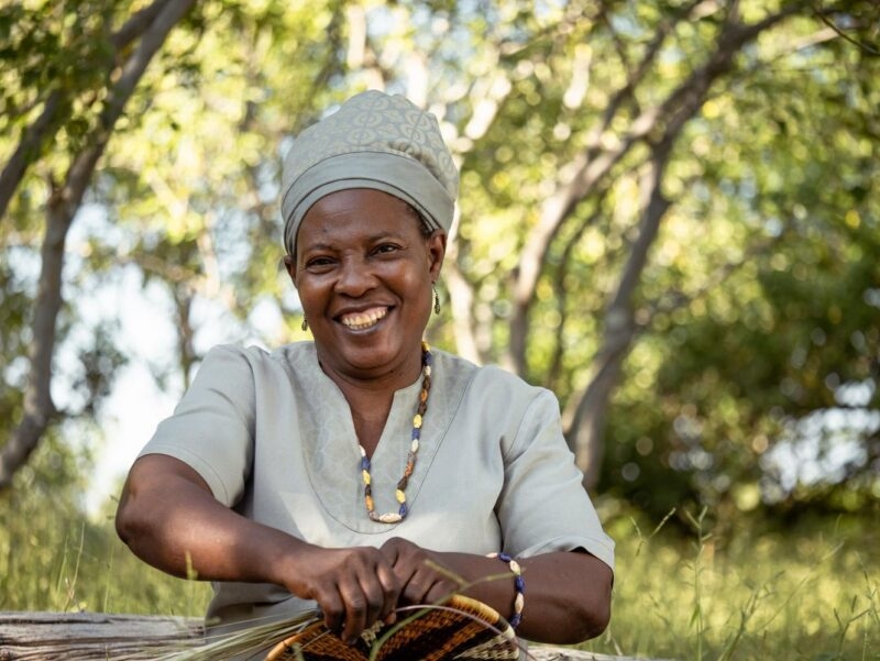 A craftswoman at Little Duma Tau in Botswana.