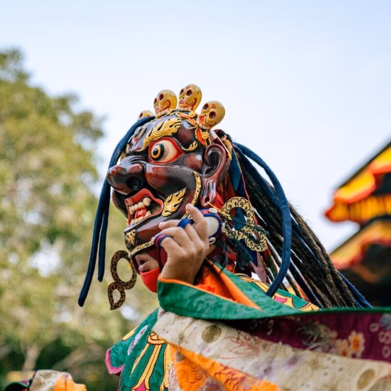 A traditionally dressed masked dancer in Bhutan.