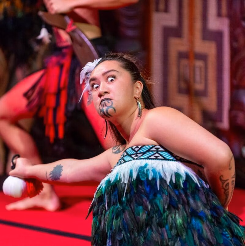 A Maori woman performing a traditional dance with a positive impact.