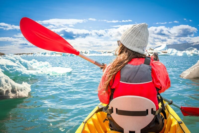 kayaking in Iceland next to an iceberg