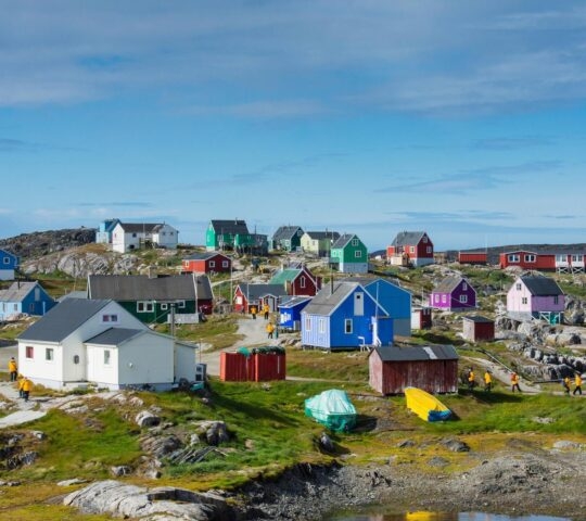 A cluster of small, colourful houses in the village of Itilleq in Greenland