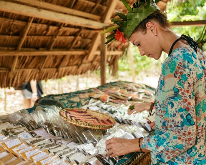 Female tourist selects spices on the market