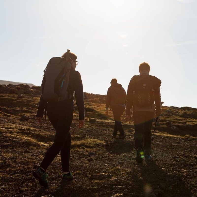 Group of friends exploring the never ending highlands in the Faroe Islands