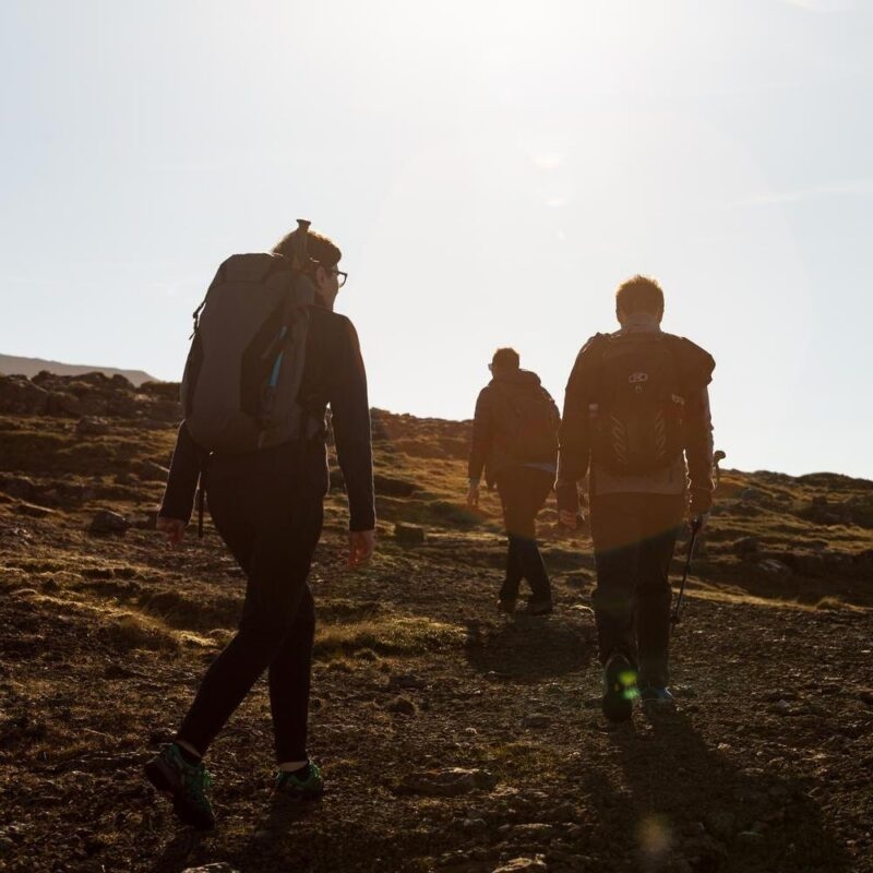 Group of friends exploring the never ending highlands in the Faroe Islands