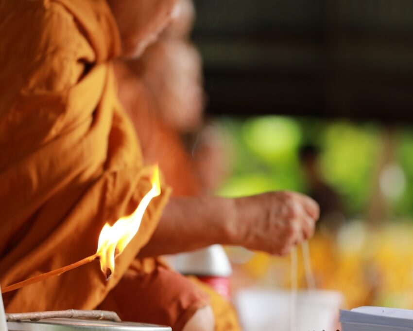 A candle lit by a monk for a fire ceremony in a temple in Japan.