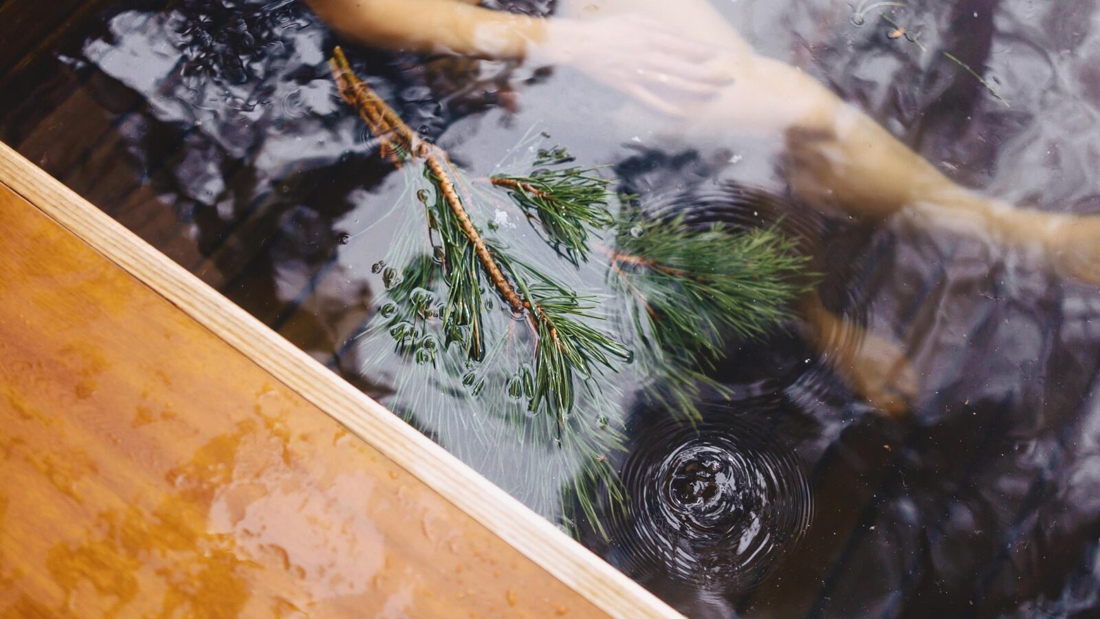 relaxing in a hot tube amidst the wintery Switzerland