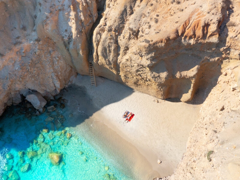The famous Tsigrado beach with crystal clear waters and rocks. Milos Greece