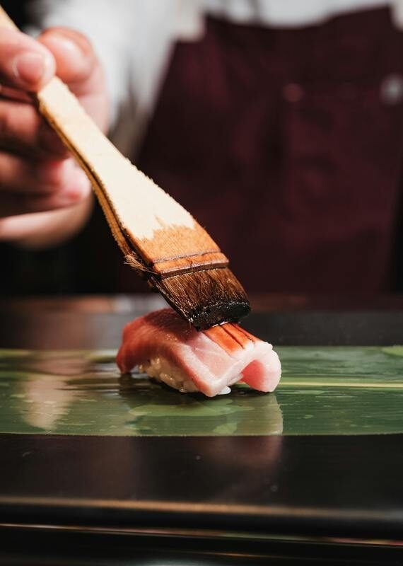 making sushi for a private dinner and wellness experiences