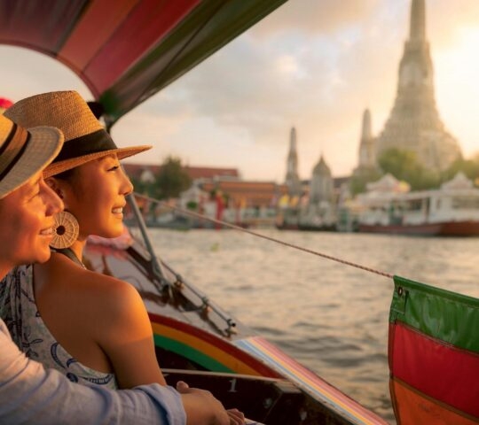 Couple traveller with boat in the Arun temple