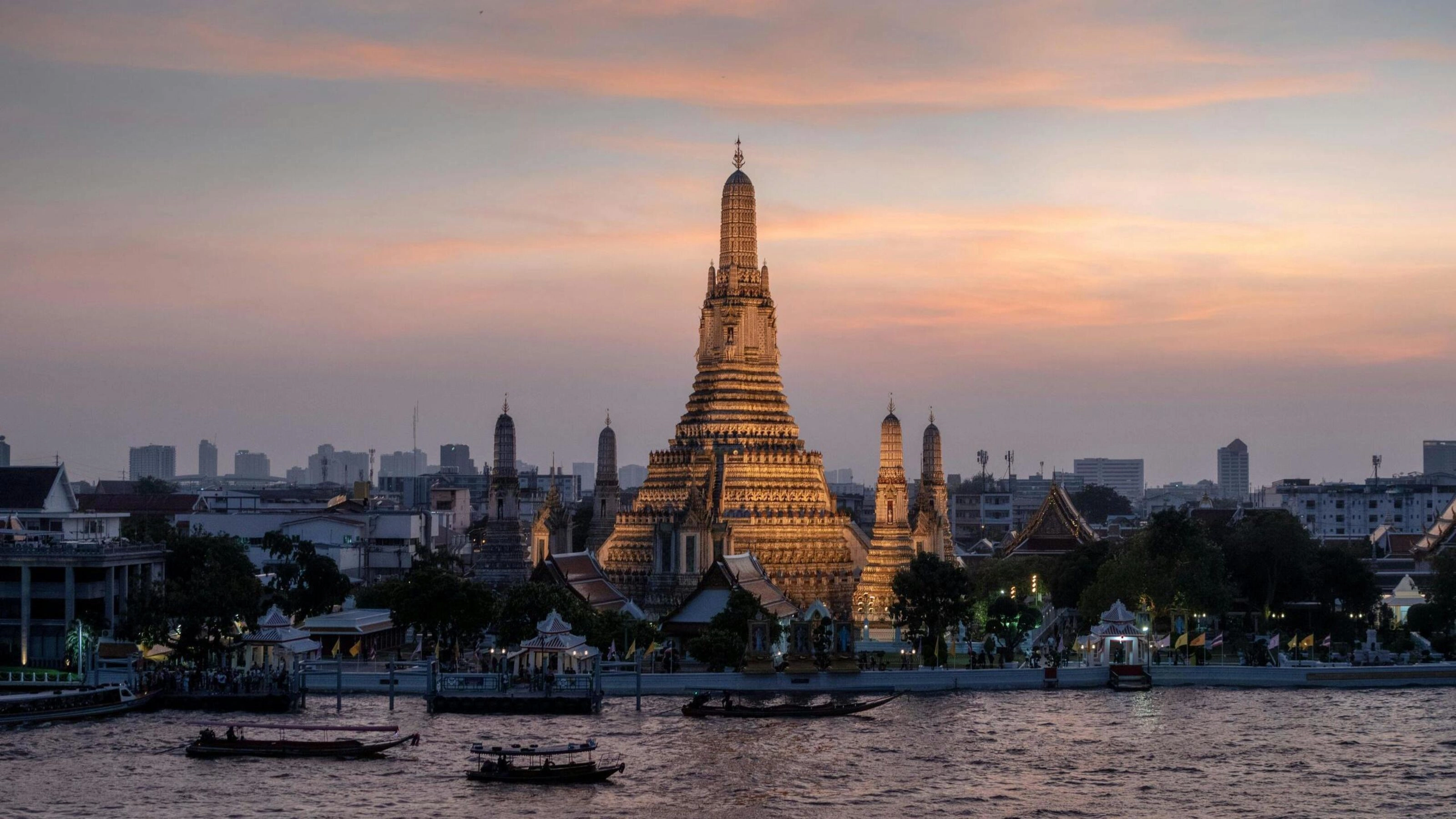 Bangkok view sunset Thailand with traditional boats