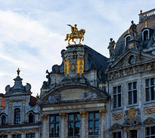 A close-up look at the architectural details of the Grand Palace in Brussels.