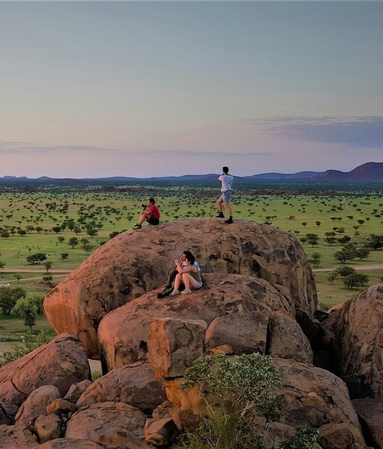 Taking in the wide-open views and fading light over the rocky landscapes of Damaraland, Namibia.