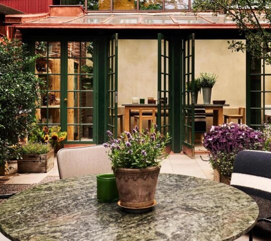 The outdoor dining area at Ett Hem, located in the garden.