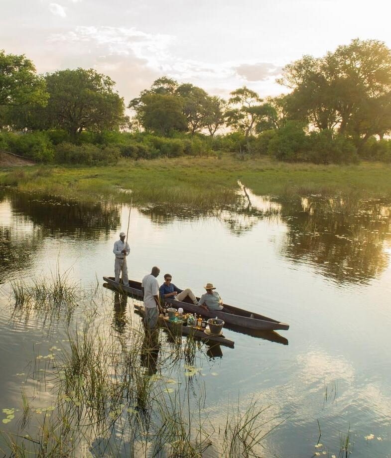 A classic sundowner in South Africa’s Kruger National Park, and a private mokoro safari drifting through Botswana’s Okavango Delta as the light turns golden.