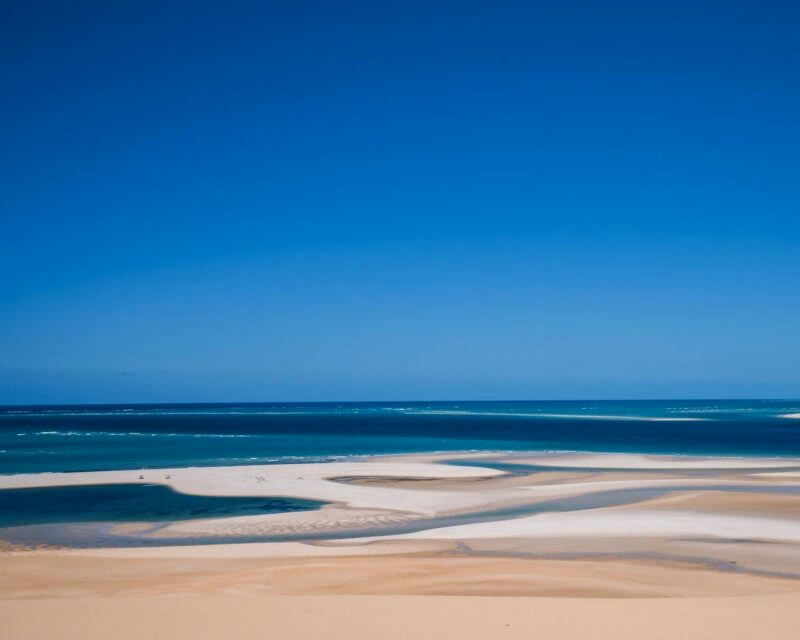 Aerial view of white sandbanks and turquoise ocean water at Bazaruto Archipelago in Mozambique.