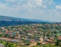 The Kigali city skyline featuring various modern skyscrapers and urban development on a sunny day.