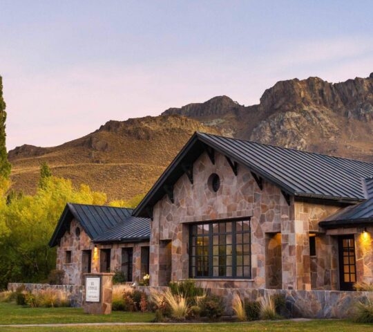 View of the main lodge at Explora Patagonia National Park in Chile in warm lighting