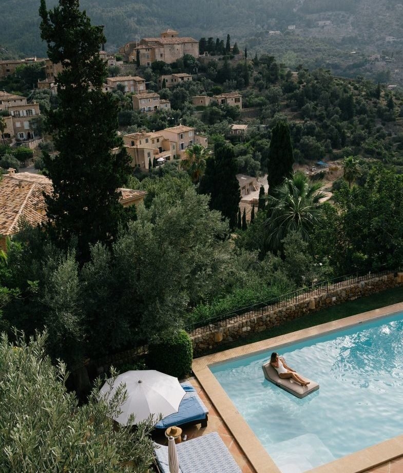 A relaxing day by the swimming pool at Belmond La Residencia, and Hotel Arts Barcelona rising above the Mediterranean beachfront at sunset.