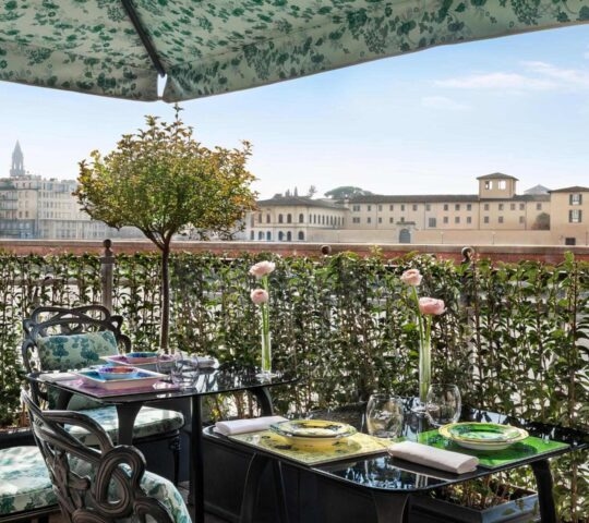 The roof terrace of the St Regis hotel in Florence, showing views over the city
