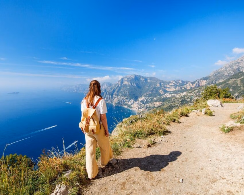 A woman walking the coastal Path of the Gods, Amalfi, Italy