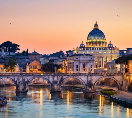St Peters Basilica in Rome lit up at sunset
