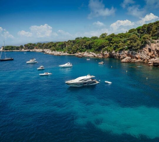 A yacht in a cliffside swimming area on the Cote d'Azur