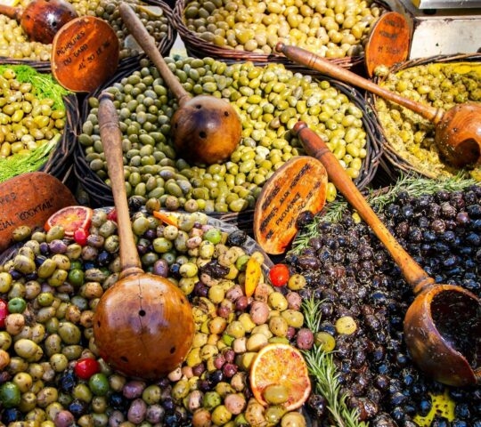 A market stall featuring different kinds of olives at the Avignon food market in France