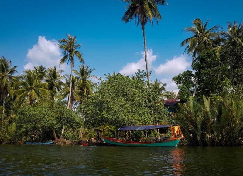 A fishing village with a boat in Wild Cambodia