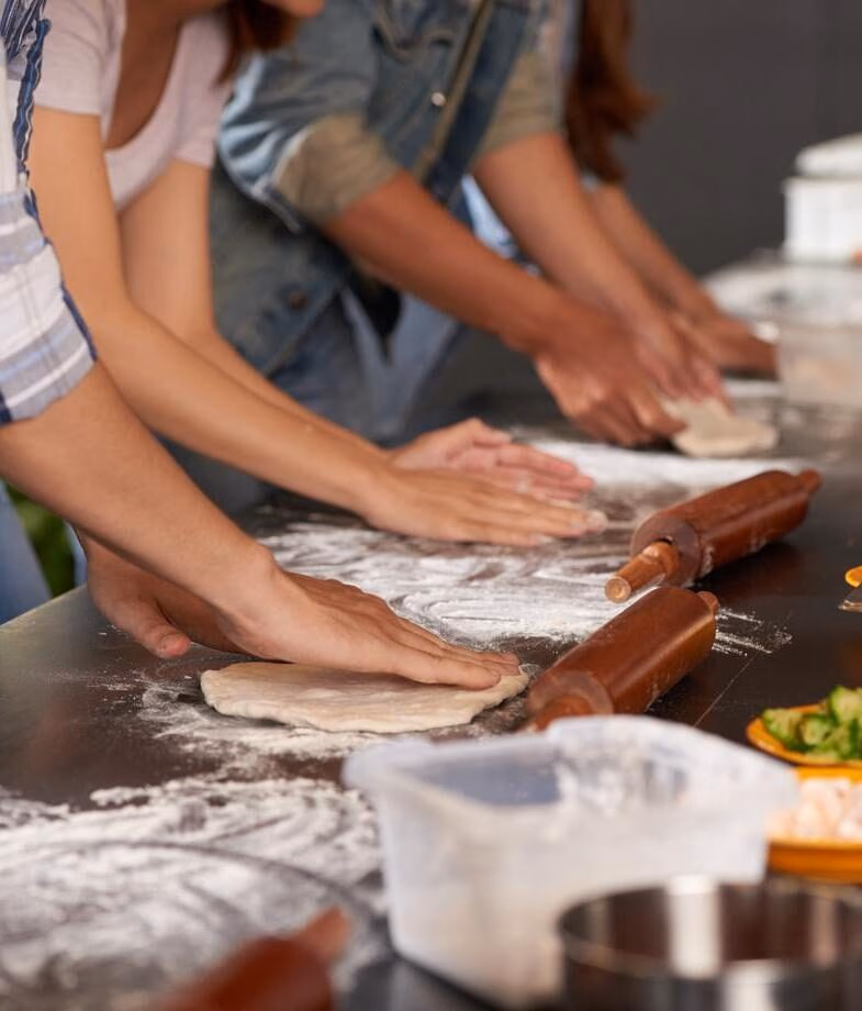 Engage in traditional cuisine with a tea ceremony in Japan or a pizza making workshop in Italy