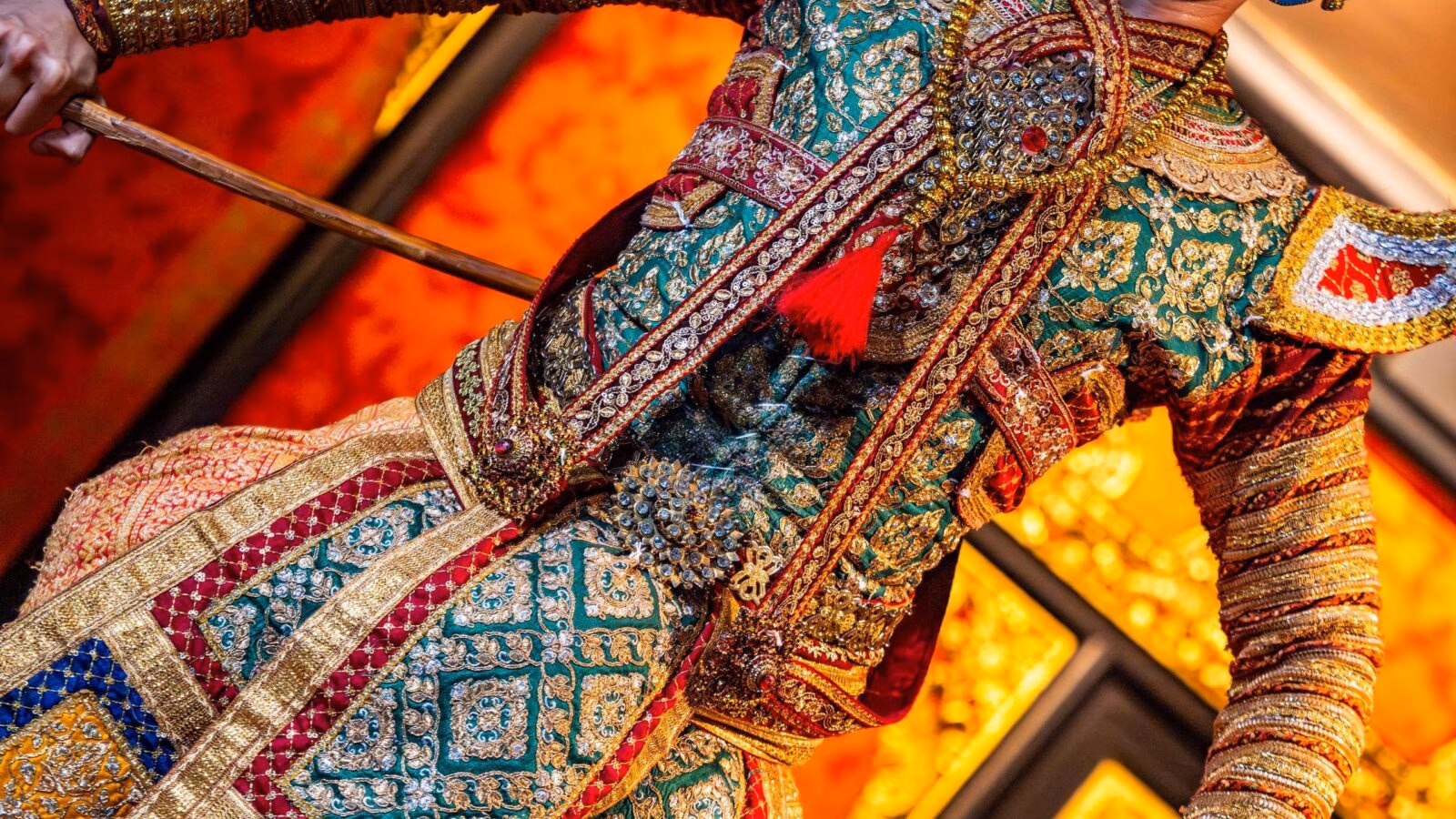 A traditional Thai dancer in traditional performance clothing.