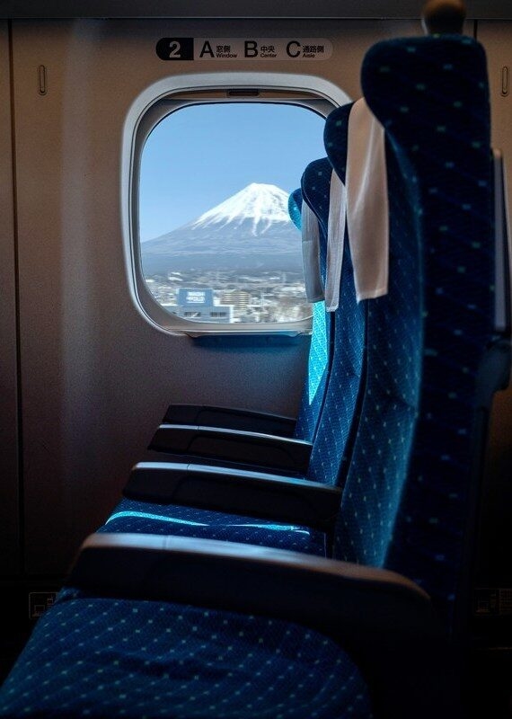View of Mount Fuji from the window of a train carriage in Japan