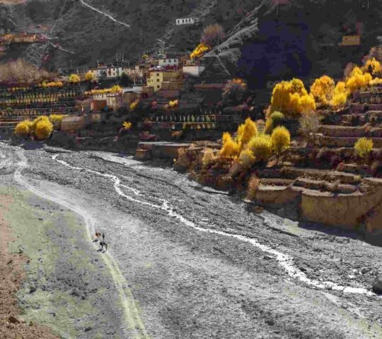 An image of people hiking along Panda Khola River gorge towards Lupra village in Nepal