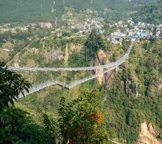 A suspension bridge with bungee jumping across a deep gorge in Kushma, Nepal.