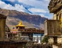 A monastery in Mustang, Nepal, with mountains in the background