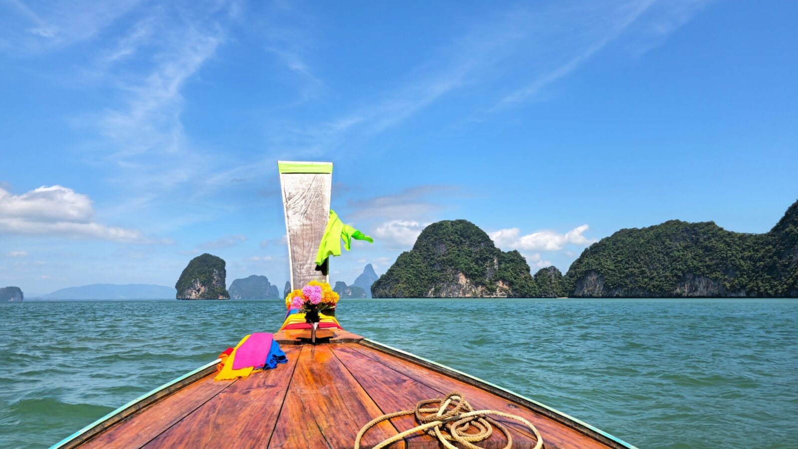A longtail boat on the waters of Phang Nga bay in Thailand
