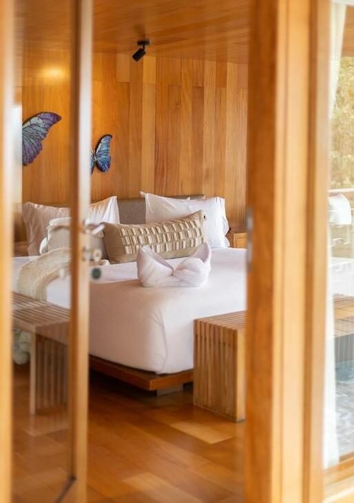 Enjoy an Amazon River cruise on the Delfin I, relaxing in your spacious suite on board and looking out for wildlife on jungle walks.