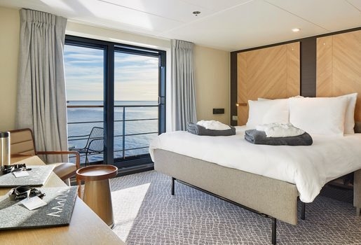Cruise past colossal glaciers on the Magellan Explorer, watch icebergs drift past your cabin window, and head out on a Zodiac to spot penguins and other wildlife.