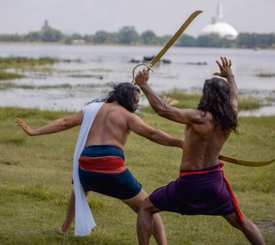 Men practising the ancient martial art of Angampora in Sri Lanka