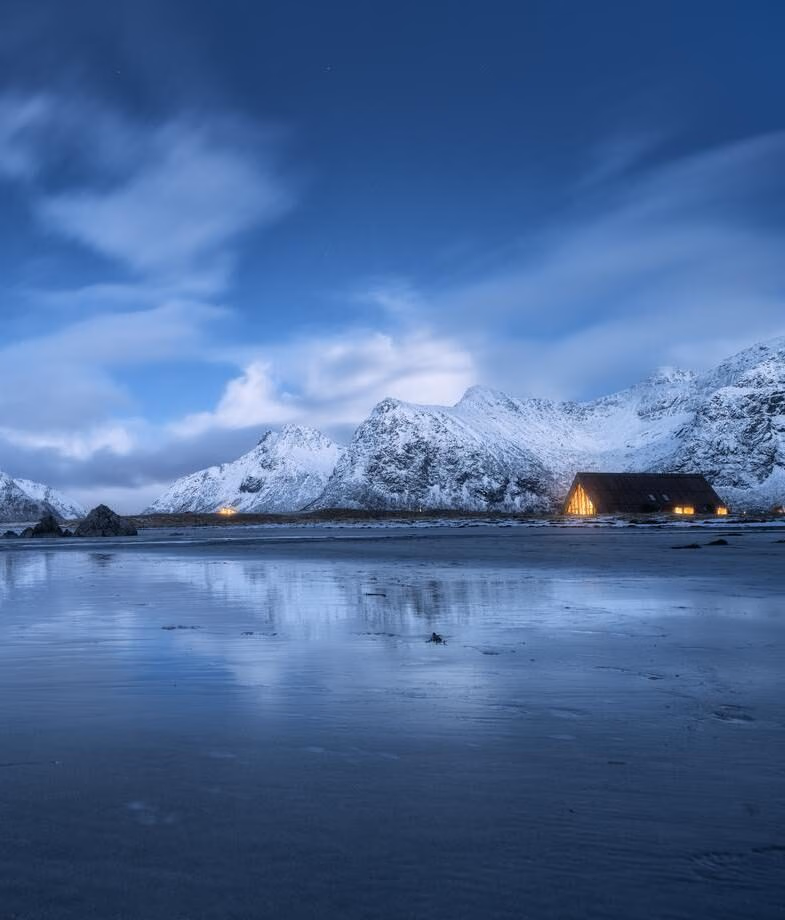 Experience Norway’s blue hour as the Arctic coast settles into twilight and warm lights glow beneath snow-covered peaks. Try your hand at Japan’s centuries-old ceramic traditions in a pottery workshop.