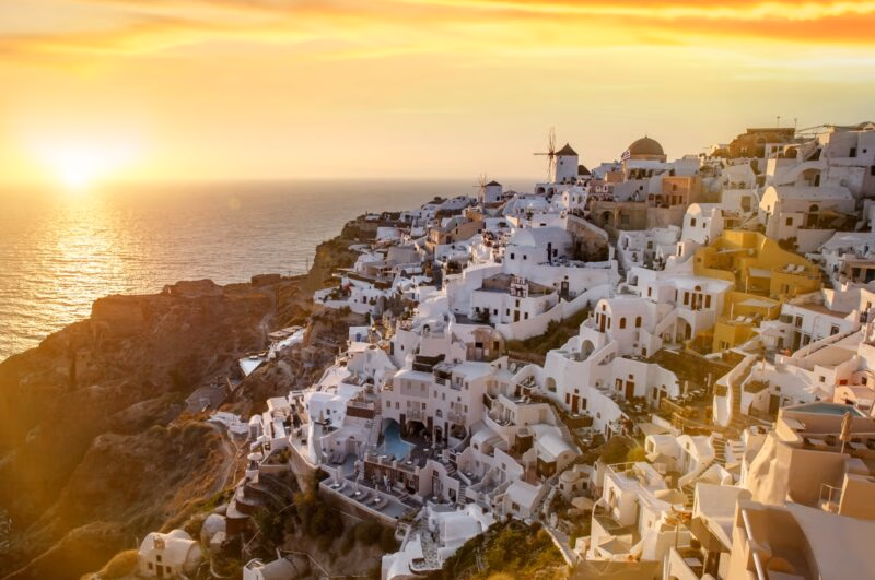 Impressive evening view of Santorini island. Picturesque sunset on the famous Greek resort Oia, Greece, Europe.