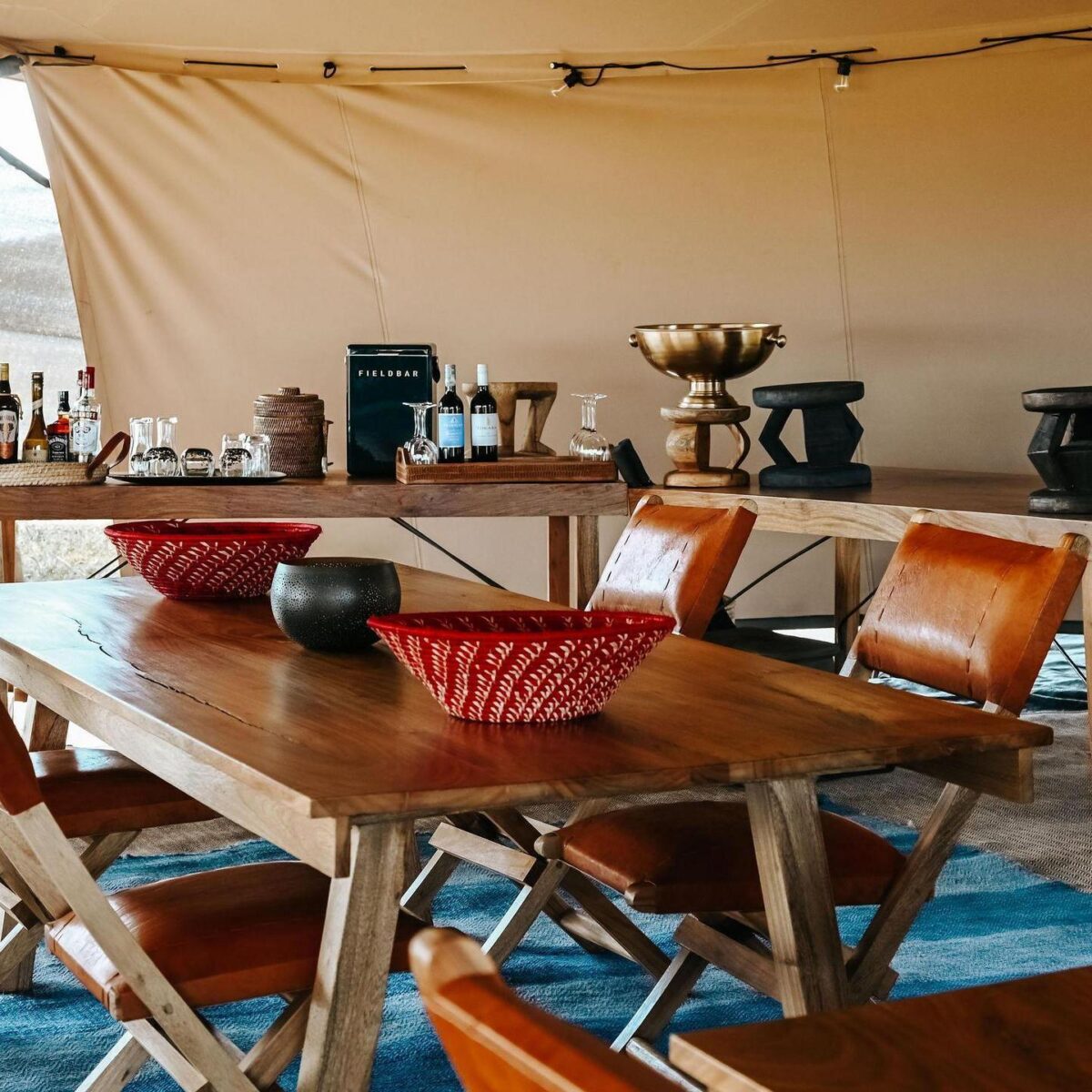 Usawa camp dining area with wooden furniture