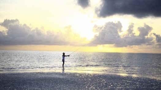 Fishing on the beach Mnemba Island, Zanzibar