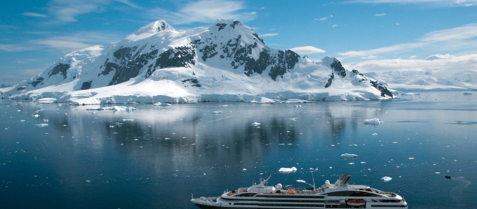 Antarctica iceberg with cruise ship