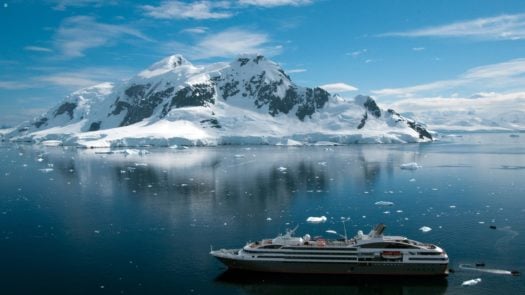 Antarctica iceberg with cruise ship