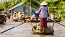 vietnamese-woman-rowing-boat-mekong-vietnam