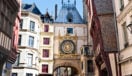Half-timbered houses and old-style clock in Rouen, France